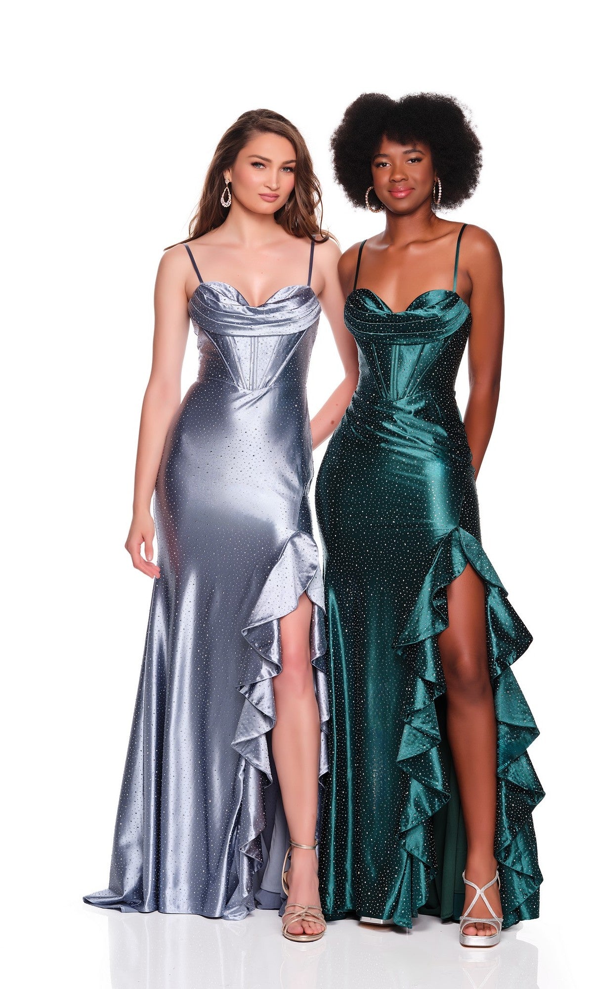 Two women stand side by side in long evening gowns with ruffle details and thigh-high slits; one wears the Lace-Up Long Satin Prom Dress: Dave & Johnny 12799 in smoke blue, while the other stuns in green.